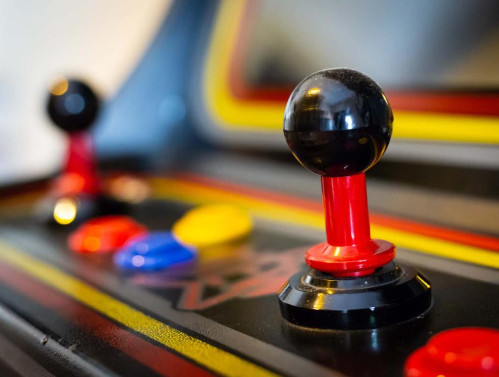 A view of a joystick of a vintage arcade videogame