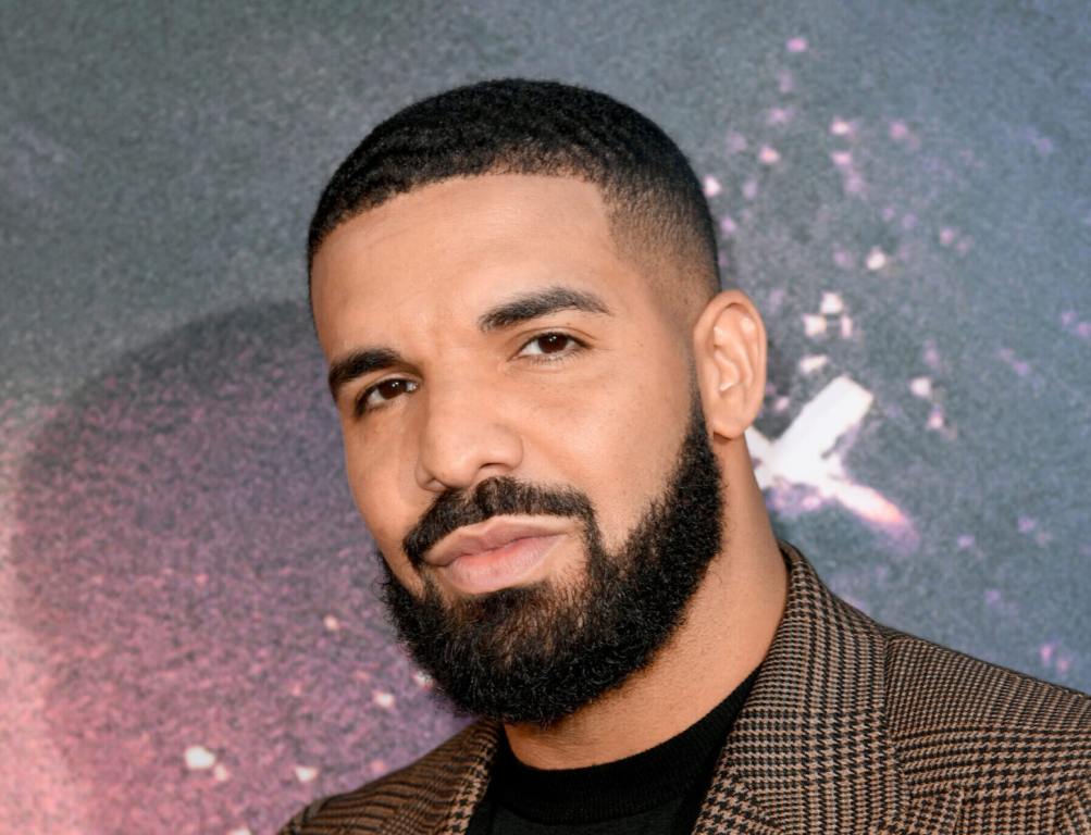 Drake attends the LA Premiere of HBO's "Euphoria" with a short haircut and full beard wearing a tweed blazer