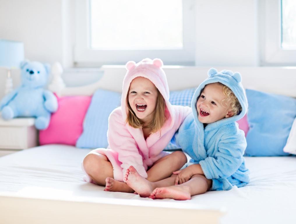 Children in bathrobe or towel after bath