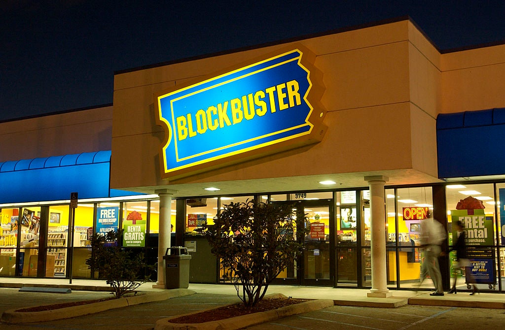 Customers walk into a Blockbuster Video store at night. The blockbuster video experience will be at comic con.