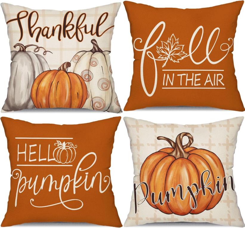 Welcome Fall in style with 4 white and orange throw pillows with pumpkin designs