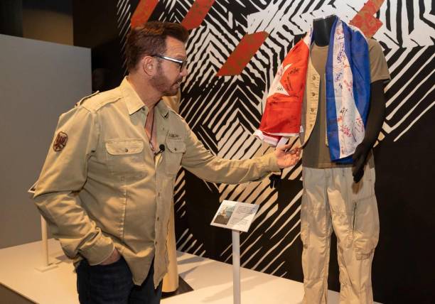 Willy Chirino tours "Willy Chirino: 50 Years of Music," on display at the HistoryMiami museum through Sept. 10. A flag signed by rafters at GuantÃ¡namo base is displayed next to the clothes Chirino wore to his concert in 1994. (Matias J. Ocner/Miami Herald/Tribune News Service via Getty Images)El Porque Los Artistas Cubanos No Hablan De Política