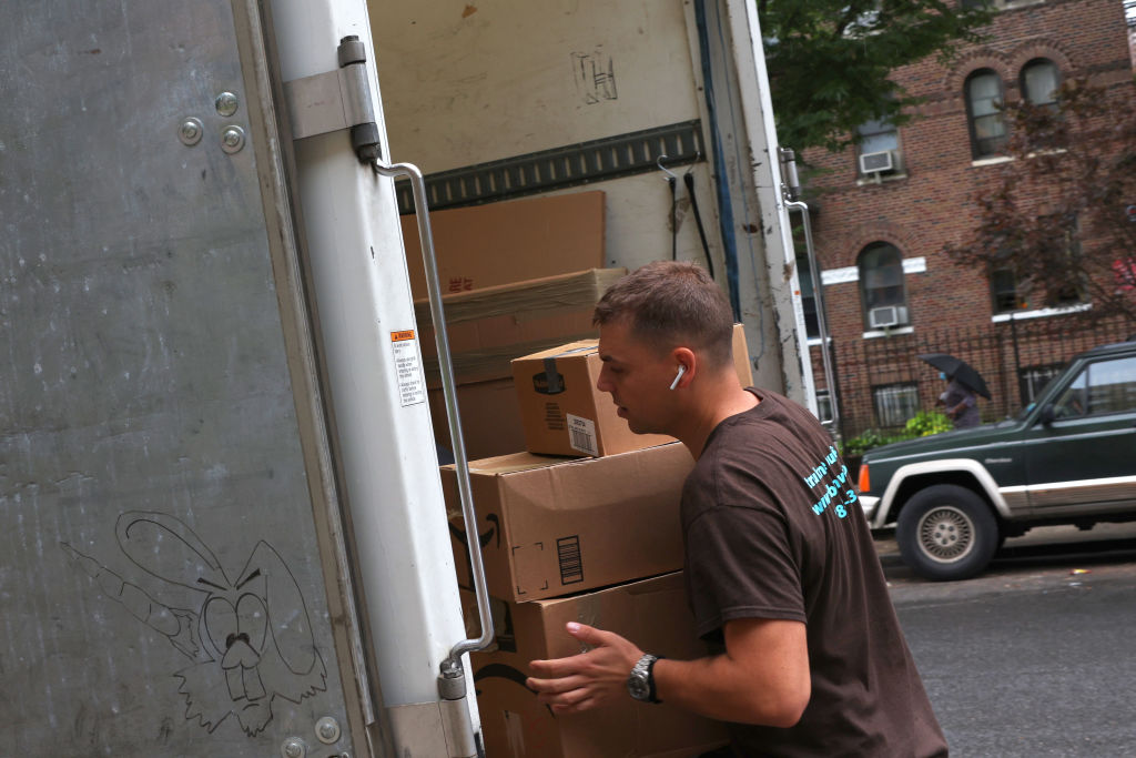 NEW YORK, NEW YORK - AUGUST 13: Dusan B., a mover with Rabbit Movers, places the belongings of a customer unto a moving truck on August 13, 2020 in New York City. Moving companies are increasingly trying to keep up with higher demand as an uptick of people are choosing to move from New York City during the COVID-19 pandemic. (Photo by Michael M. Santiago/Getty Images) move in florida